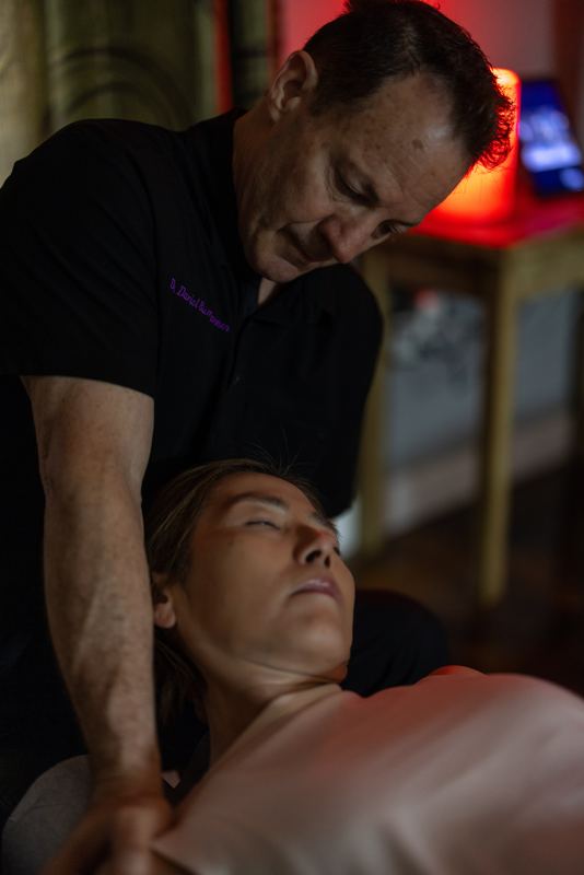 Dr. Bumgarner treating a patient's cervical spine in their home after an auto accident