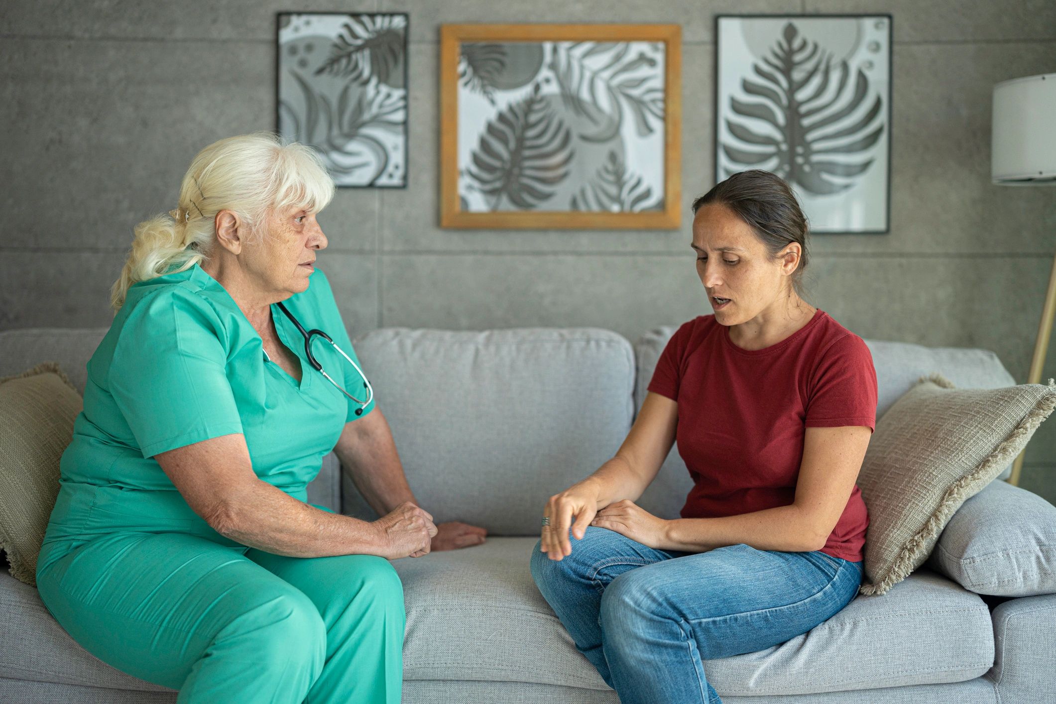 therapist treating patient at home modern